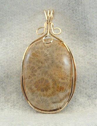 Coral handmade pendant in silver and gold wire